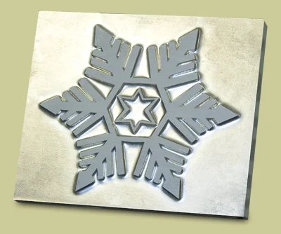Machined snowflake die on a metal plate